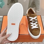 Hermes H232176Z 90350 Brown & White Sneakers – Iconic Design and Premium Craftsmanship Hermes Mens Sneaker H232176Z 90350 in Brown and White – Front View of Luxury Sneakers with Contrasting Stripes