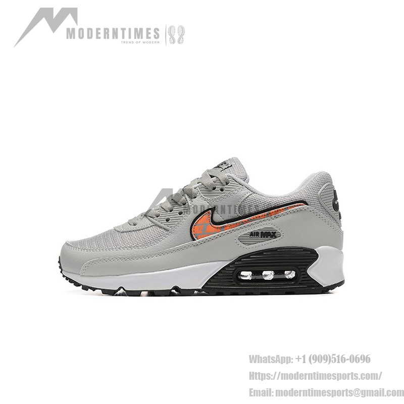 Nike Air Max 90 DZ5637-001 - グレーのスニーカー、ブラック&オレンジスウッシュ付き グレーのNike Air Max 90スニーカー、ブラックとオレンジのスウッシュが特徴的なデザイン。