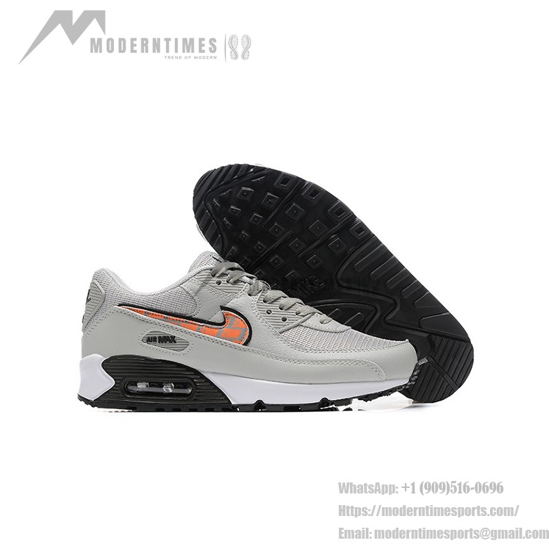 Nike Air Max 90 DZ5637-001 - グレーのスニーカー、ブラック&オレンジスウッシュ付き グレーのNike Air Max 90スニーカー、ブラックとオレンジのスウッシュが特徴的なデザイン。