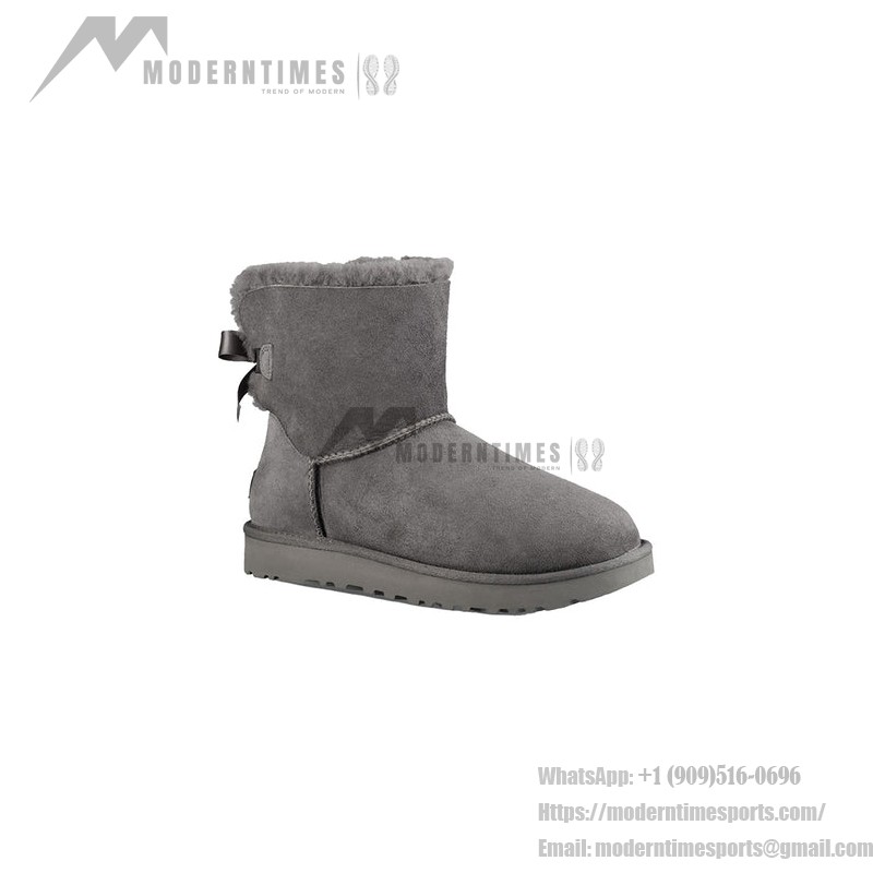 UGG ウィメンズ ミニ ベイリー ボウ II ブーツ グレー 1016501 UGG ウィメンズ ミニ ベイリー ボウ II ブーツ グレー 1016501、シープスキンライニングとリボンディテール付き