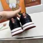 Loro Piana FAM1718-8000 Black Leather Sneakers Loro Piana FAM1718-8000 Black Sneakers Front View with White and Brown Detailing